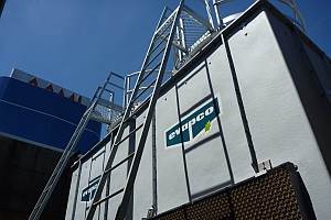 Air Condtioning Water Cooling Tower on roof, showing AAMI building in background.